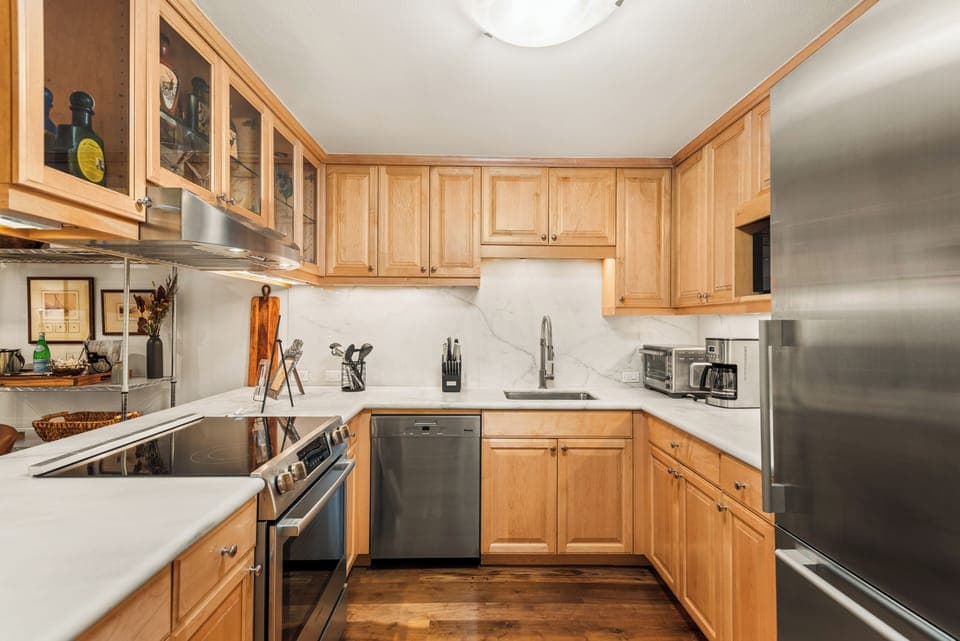 Fully-equipped kitchen with stainless steel appliances.