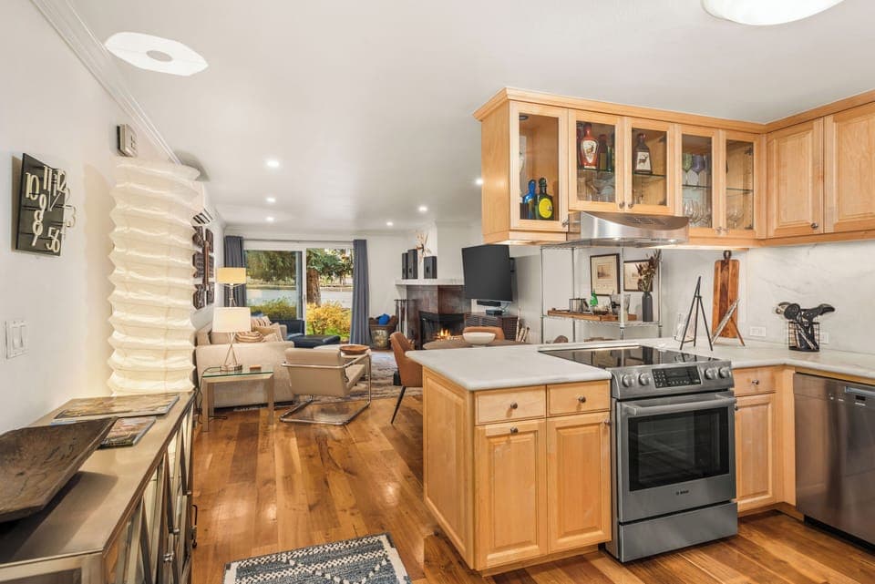Entering the condo and featuring an open-concept kitchen, dining, and living room.