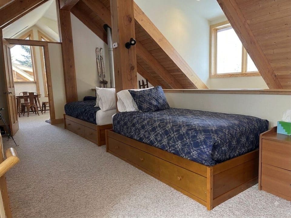 Loft landing with two twin beds - doorway to loft bedroom