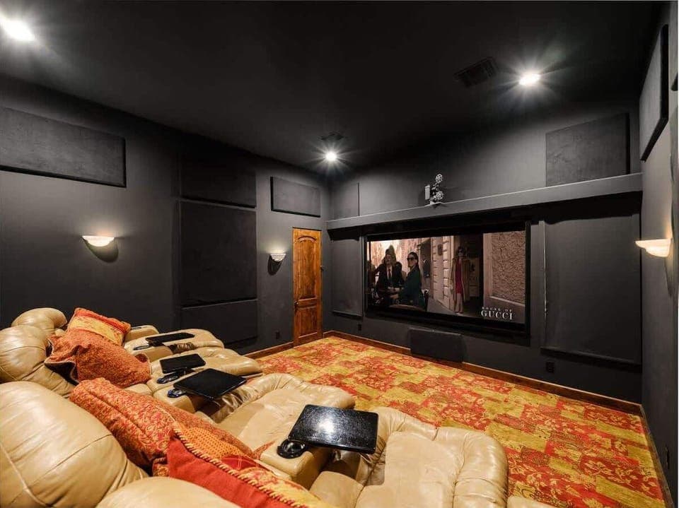 Enjoy a private movie theater complete with comfortable recliner seating for the ultimate cinematic experience.