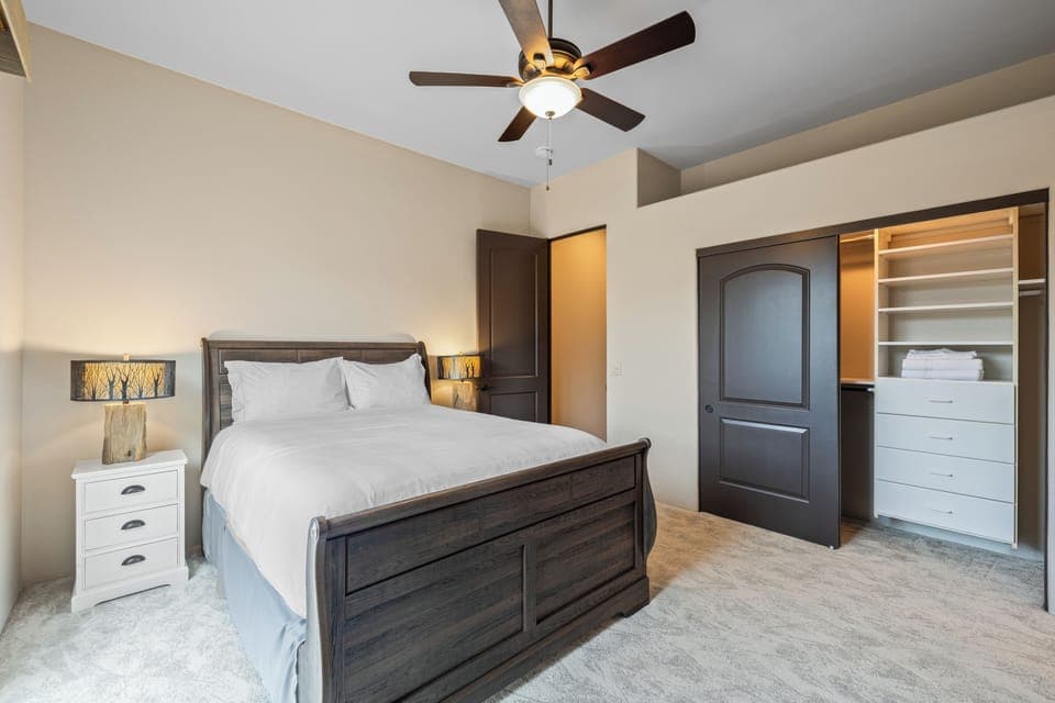 Bedroom 2 features a queen bed, outdoor views and an ensuite bathroom.