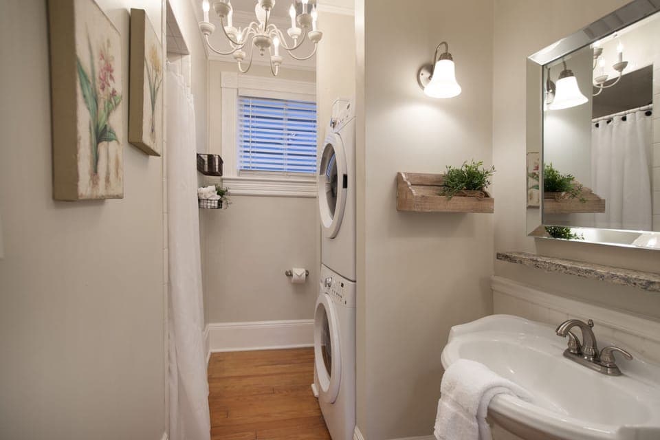 Second bath complete with rain style shower and full size washer/dryer