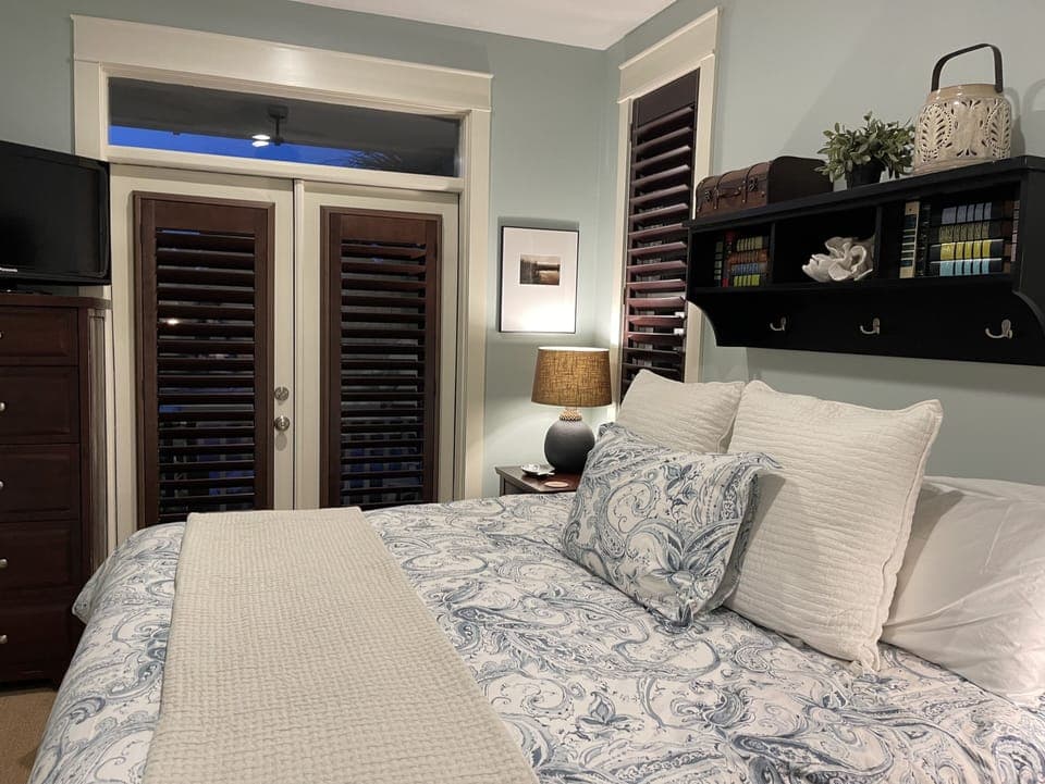 French doors with Bahamian Shutters to outside deck. 
