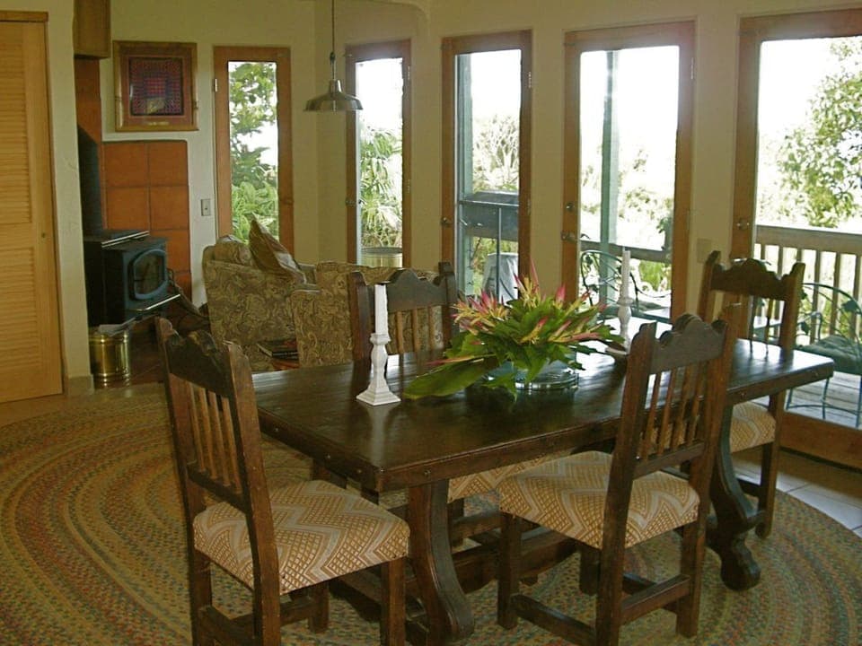 Dining Table Looking into Living Room with Wood Burning Stove