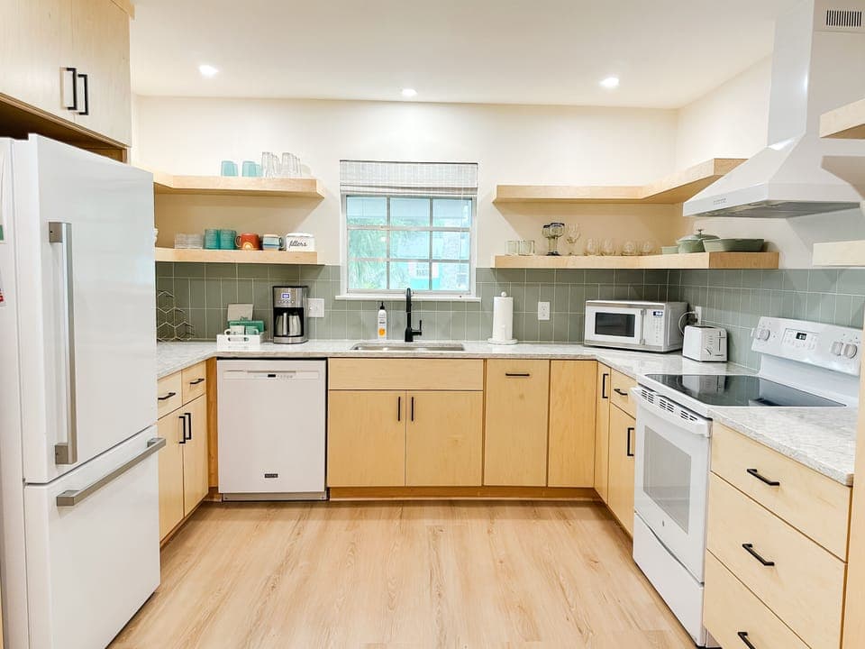 Beautiful open and airy kitchen - completely remodeled summer 2025!  This kitchen is fully stocked and so easy to get around. You'll love it as much as we do!