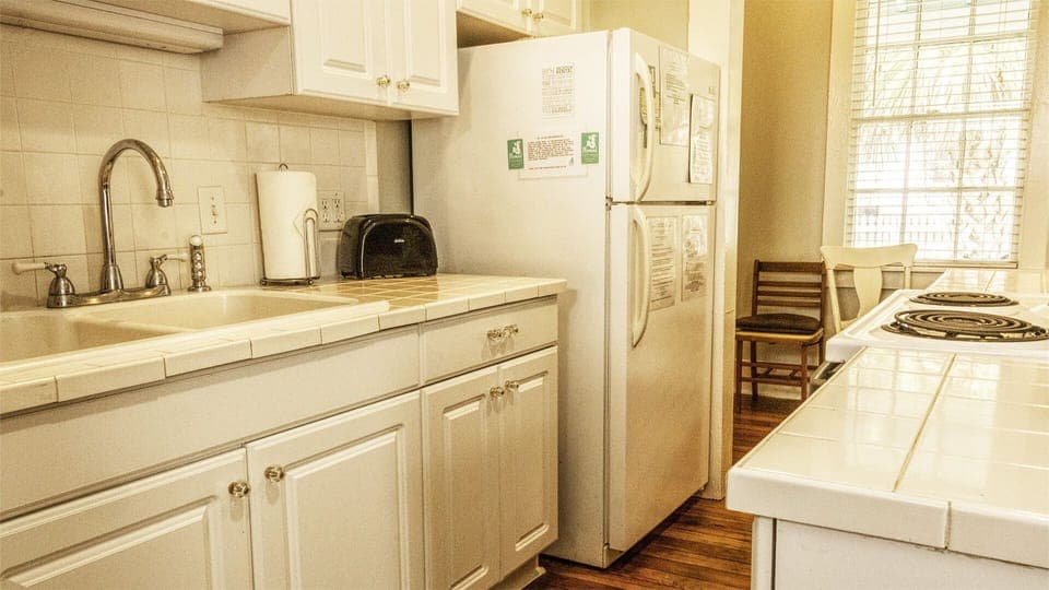 Kitchen - Designed with efficiency in mind, the kitchen maximizes its footprint and blends seamlessly into the cottage’s open living space.