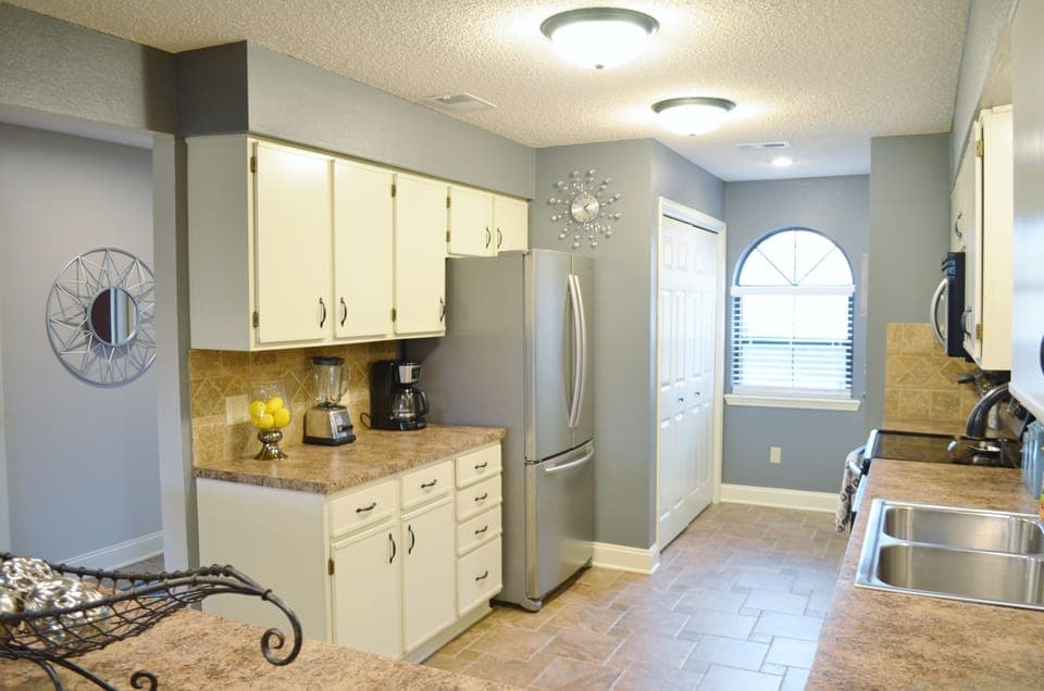 Kitchen with Full Size Washer and Dryer in Laundry Closet. Fridge has ice maker.
