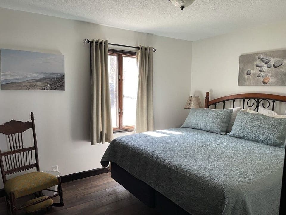 Two bedrooms downstairs, next to full bath with tub & shower. All beds are kings
