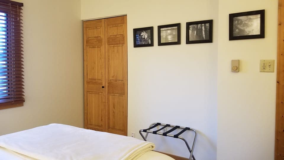 Bedroom 1: queen bed with Winkbed mattress and ceiling fan