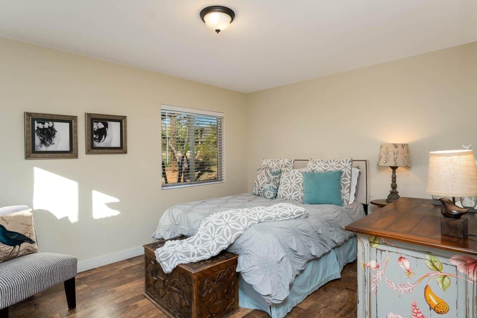 A queen bed with comfortable bedding for your enjoyment.