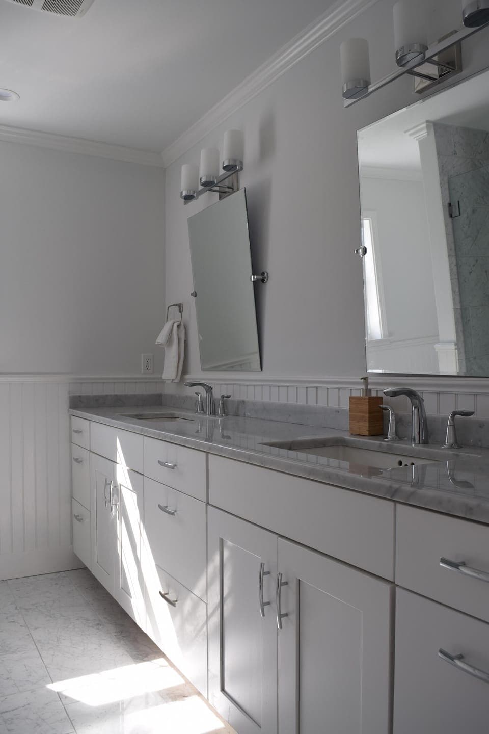 Bathroom 2; twin vanities, shower stall, toilet. Adjacent to bedroom 2
