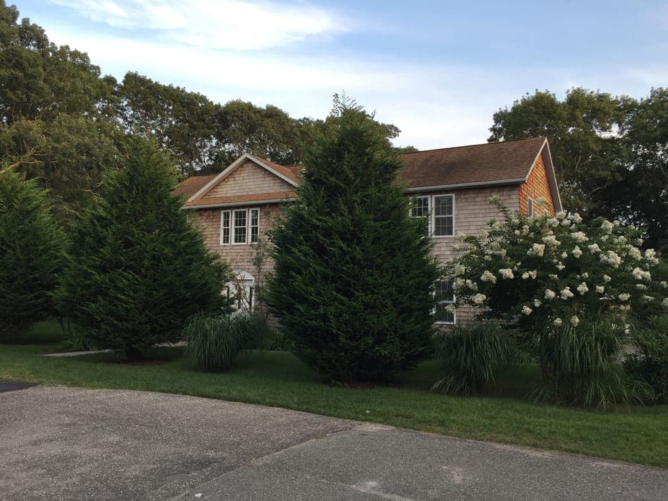 Classic cedar shake located on quiet cul-de-sac, very private 0.5 acre 