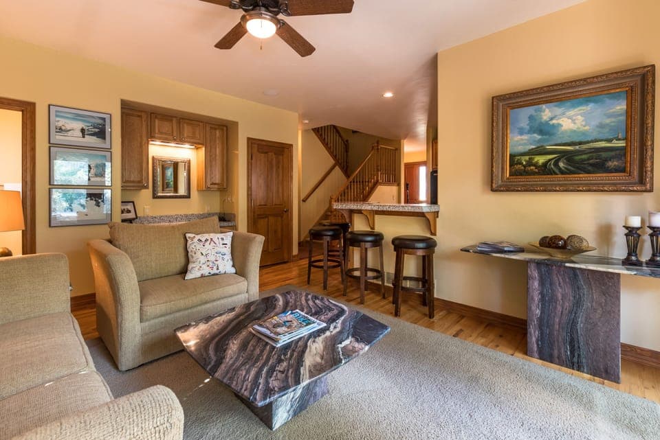 Relax in the Sitting area adjacent to kitchen overlooking deck & Eagle River!


