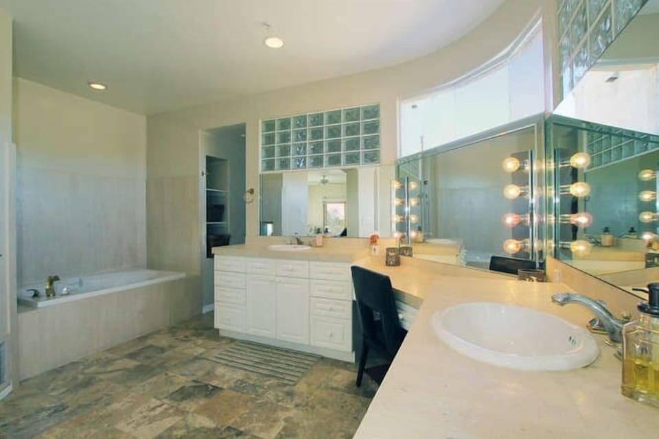 Master Ensuite w double vanity, 2 sided f/place, double shower & soaker tub 
