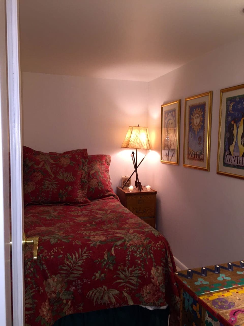 Small twin bedroom, light on.