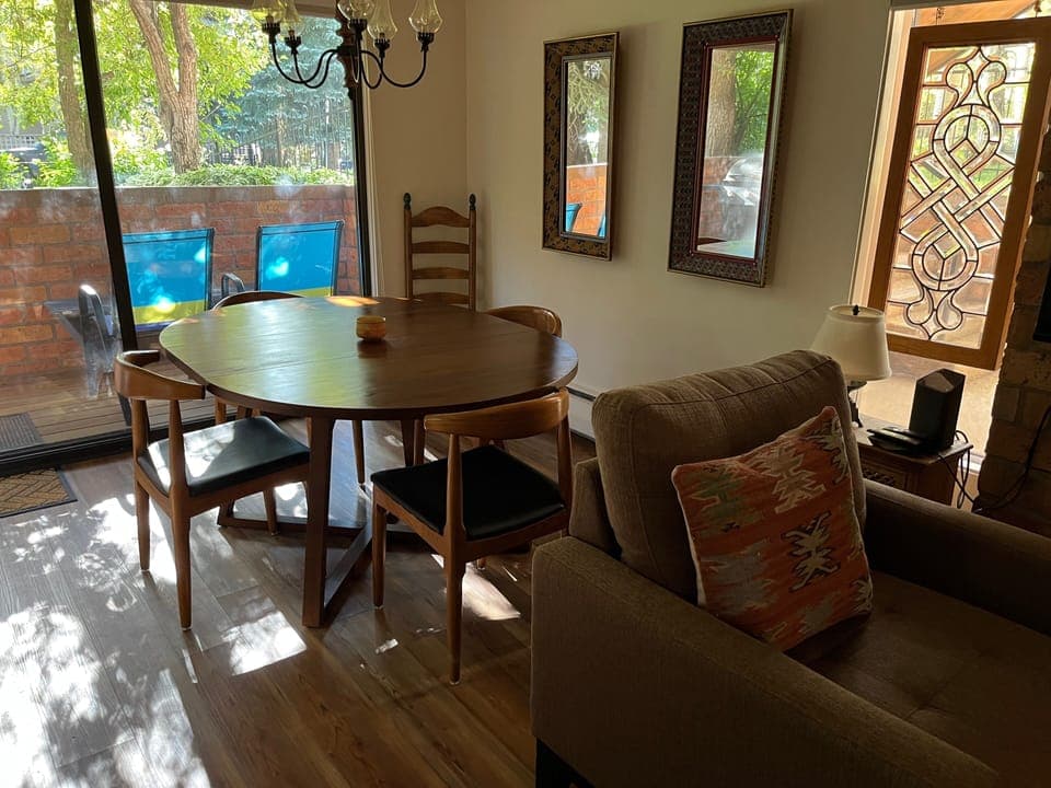 Dining area with patio and gas grill.